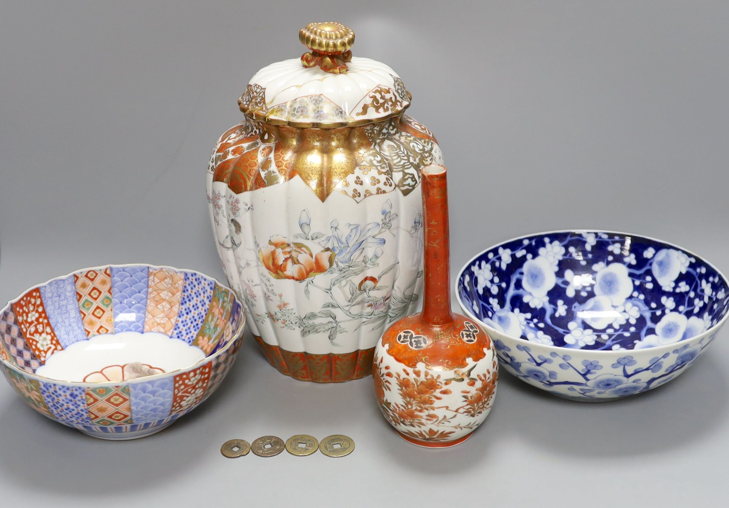 4 Chinese Qing dynasty coins, a Japanese kutani bottle vase, similar vase and cover (a.f), an Imari bowl and blue and white bowl. Largest 27cm